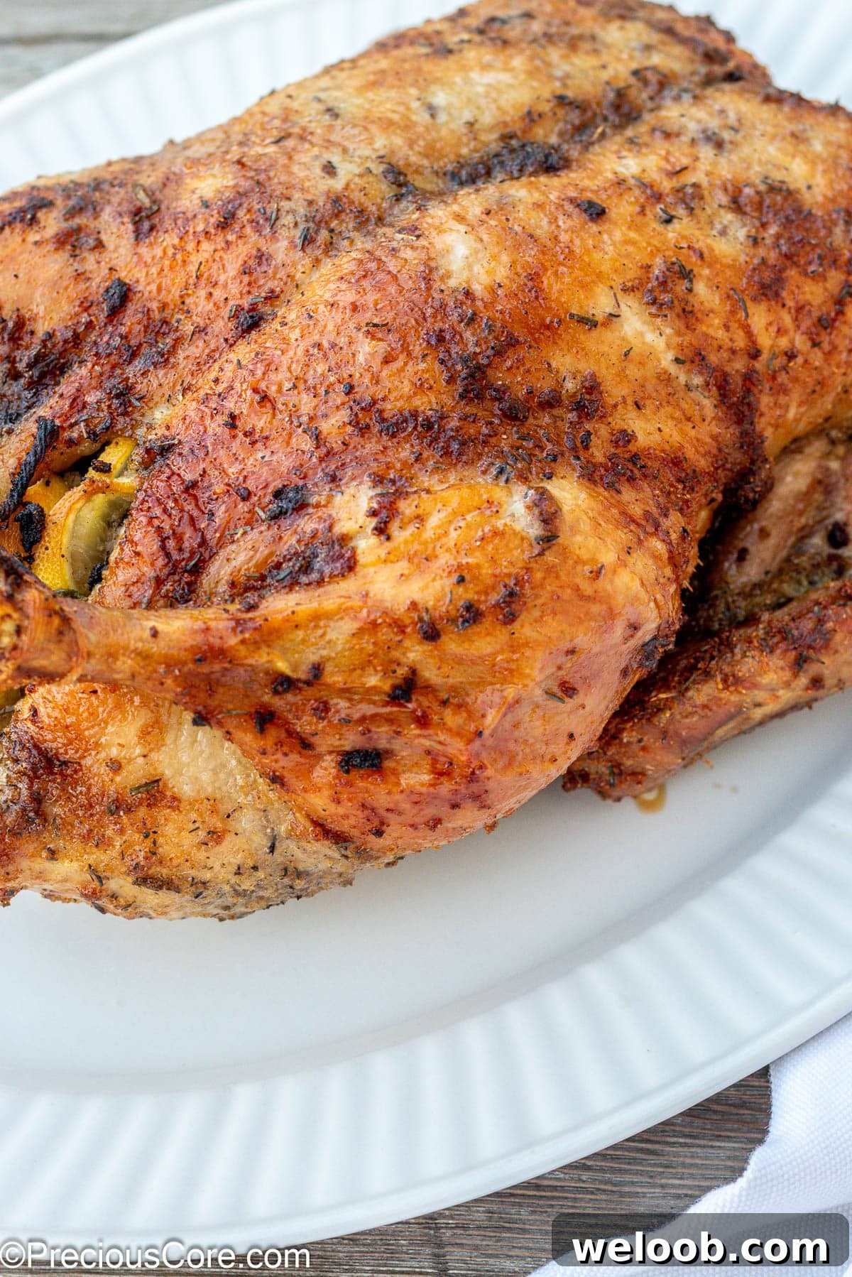 Herb Roasted Duck on a white serving tray.