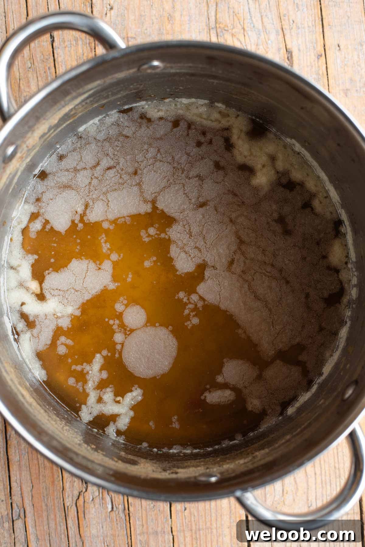 A photo of showing a layer of fat on some Italian meat broth.