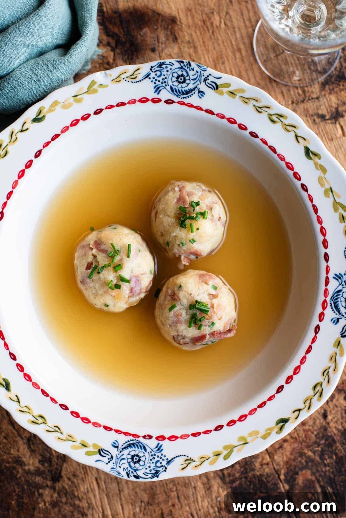 An overhead shot of Canederli, Italian bread dumplings in broth.