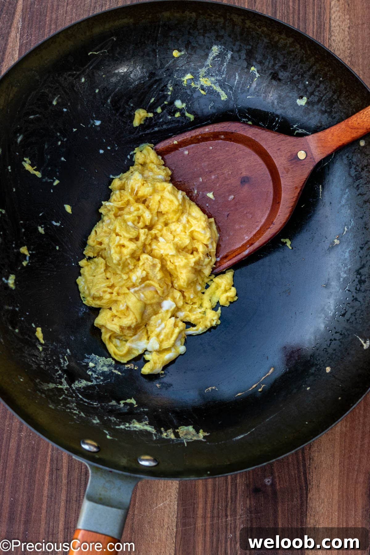 Scrambled eggs in a wok.