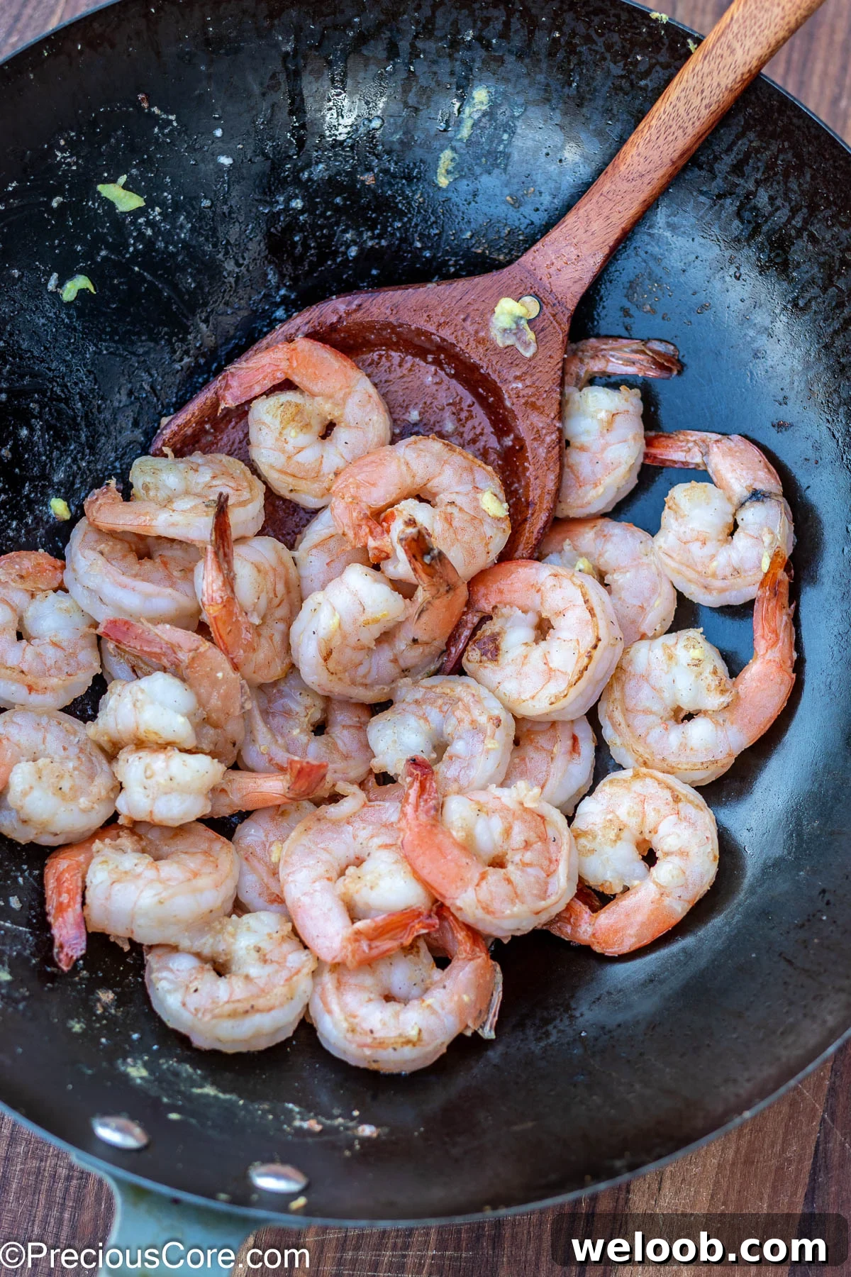 Cooked shrimp in a wok.
