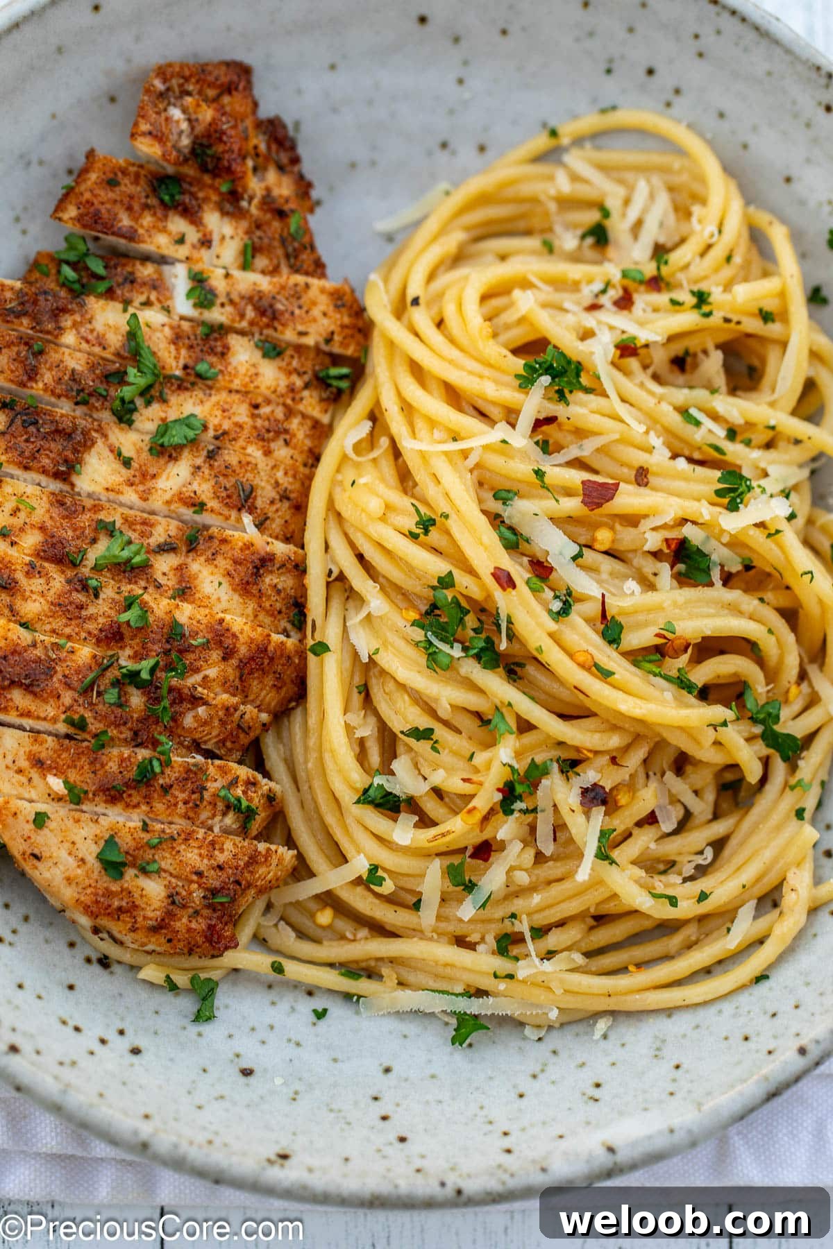Garlic butter chicken pasta in pasta bowl.