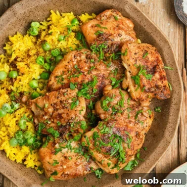 Square image of pan seared boneless chicken thighs.