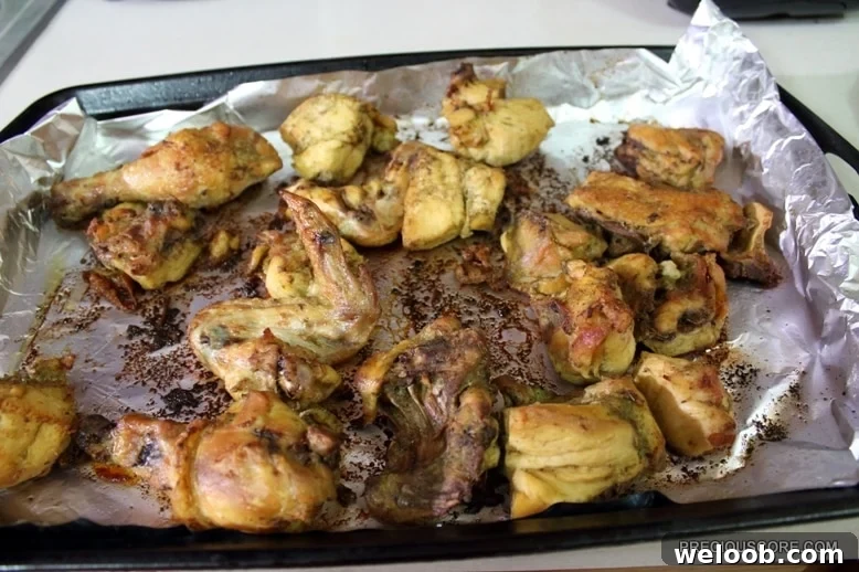 Poulet DG Recipe: How to Make Cameroon’s Classic Chicken Dish 10 Oven grilled chicken in a lined baking dish.