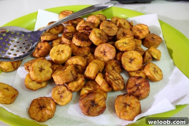 Poulet DG Recipe: How to Make Cameroon’s Classic Chicken Dish 11 Fried plantains on a paper towel.