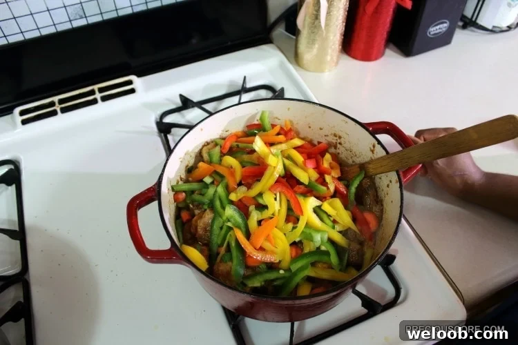 Poulet DG Recipe: How to Make Cameroon’s Classic Chicken Dish 16 Colorful vegetables in a Dutch oven with chicken.
