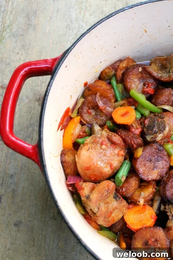 Poulet DG Recipe: How to Make Cameroon’s Classic Chicken Dish 3 Poulet DG in a red Dutch oven.