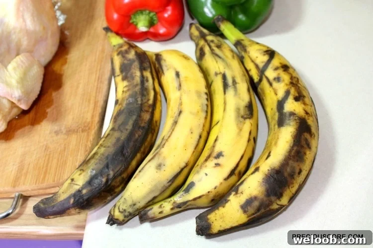 Poulet DG Recipe: How to Make Cameroon’s Classic Chicken Dish 5 Brown plantains with peppers on a counter.