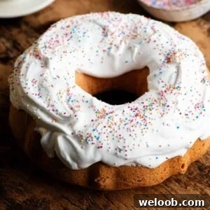 A close up of an Italian Easter bundt cake topped with meringue and sprinkles.