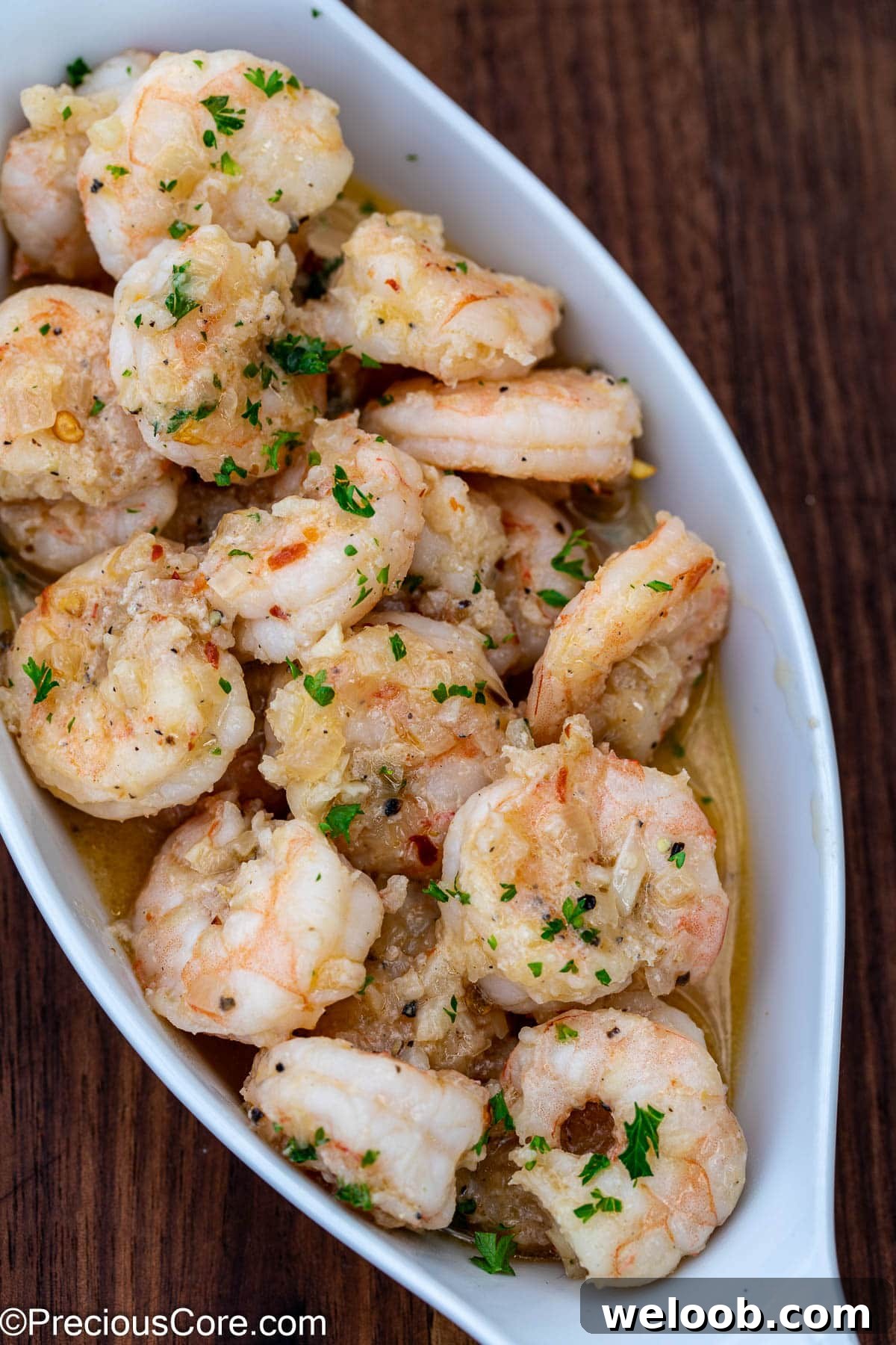 Shrimp served in a small white serving bowl.