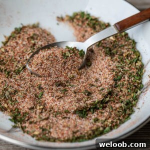 A spoon grabbing some of the best seasoning for French fries.