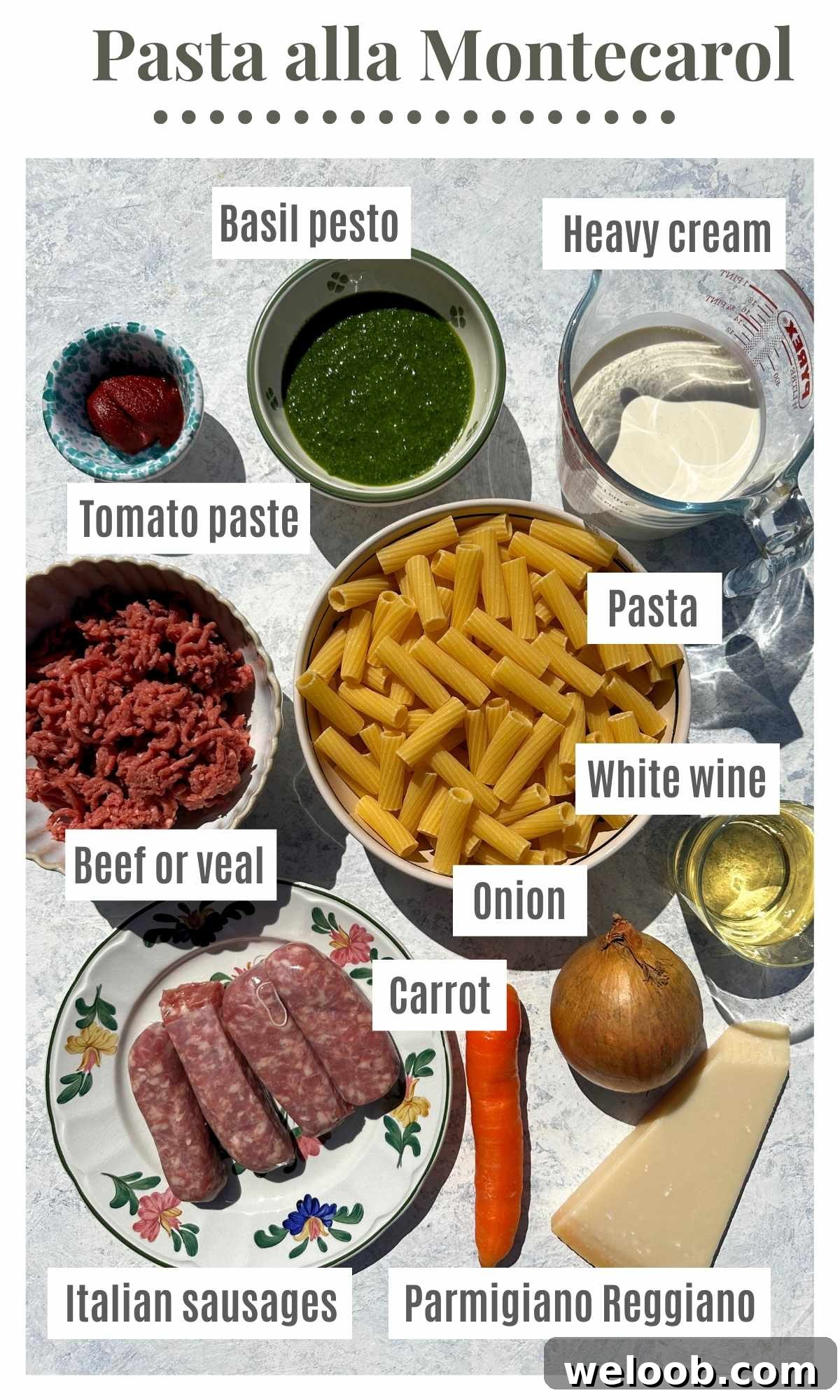 An overhead shot of all the ingredients needed to make Pasta alla Montecarlo; pesto, heavy cream, tomato paste, pasta, sausages, beef, carrot, onion, Parmesan and white wine.