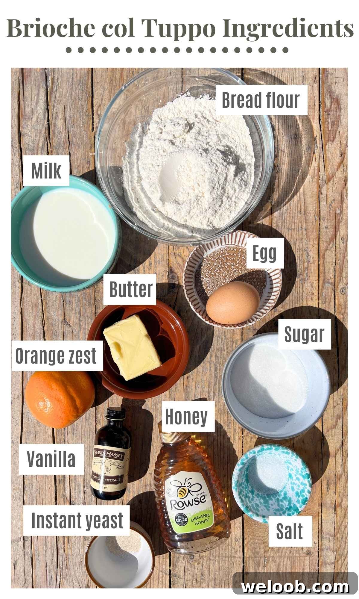 All the ingredients needed to make Sicilian brioche buns laying on a rustic wooden surface.
