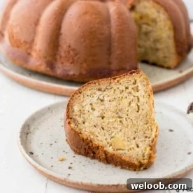 Slice of plantain cake on speckled plate