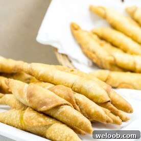 Plate and basket of Cameroonian fish rolls.