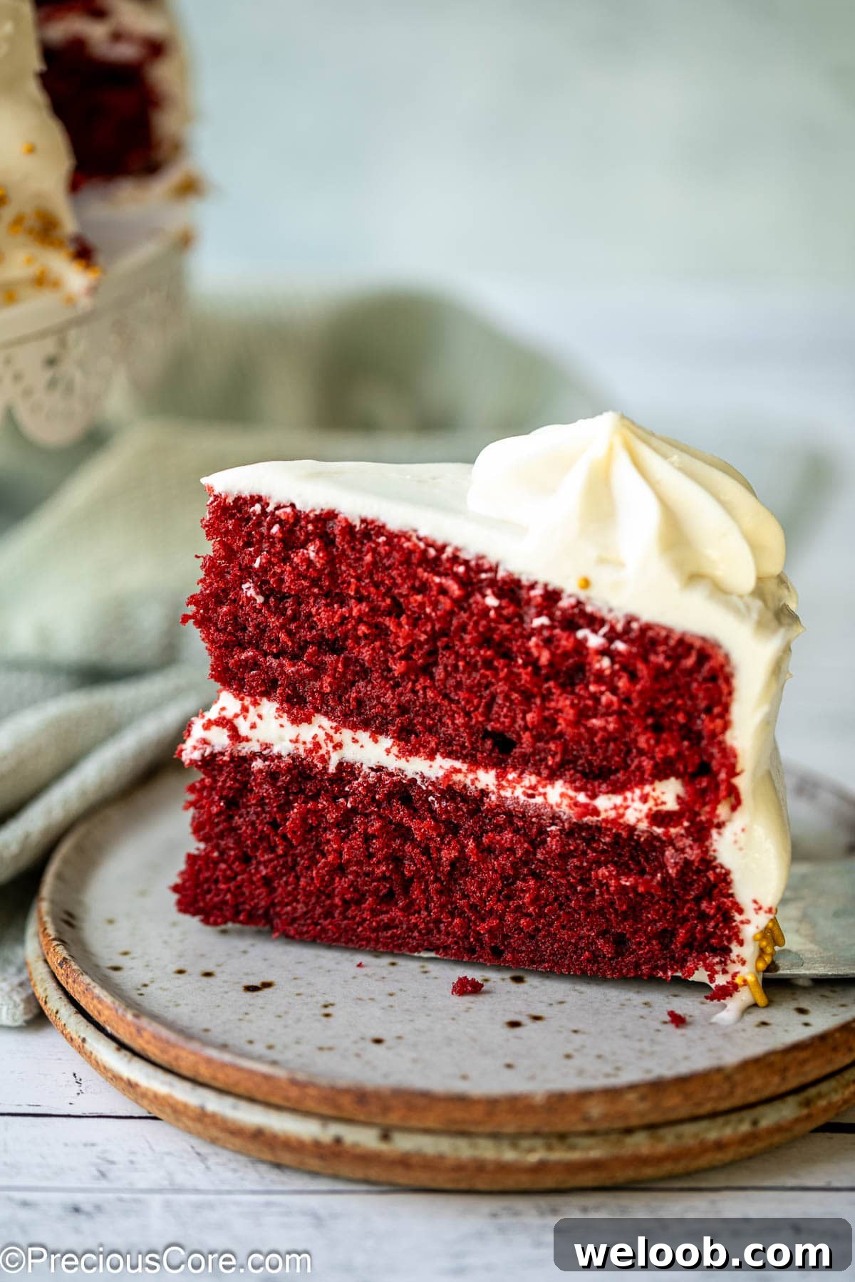 A slice of red velvet cake on a plate.