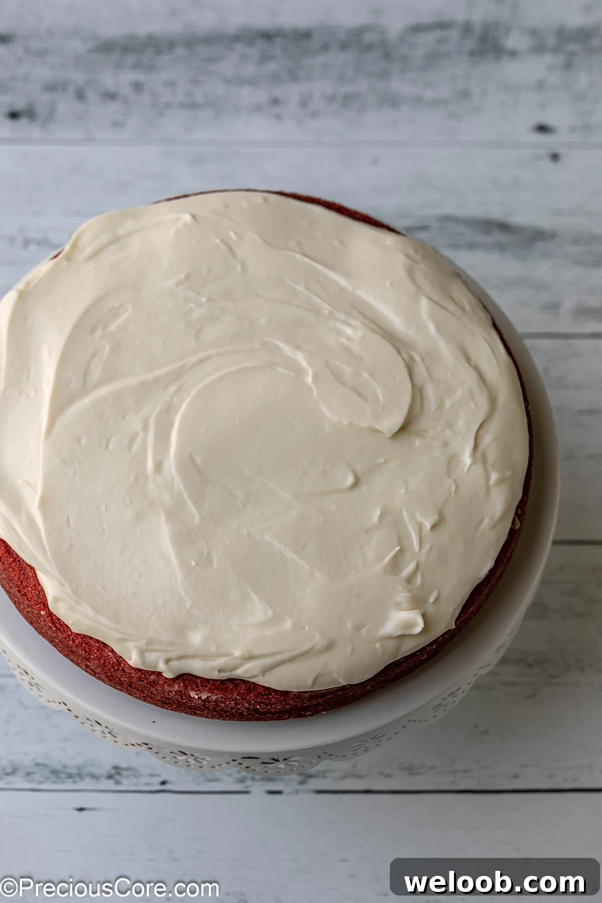 Frosting on the first layer of cake.