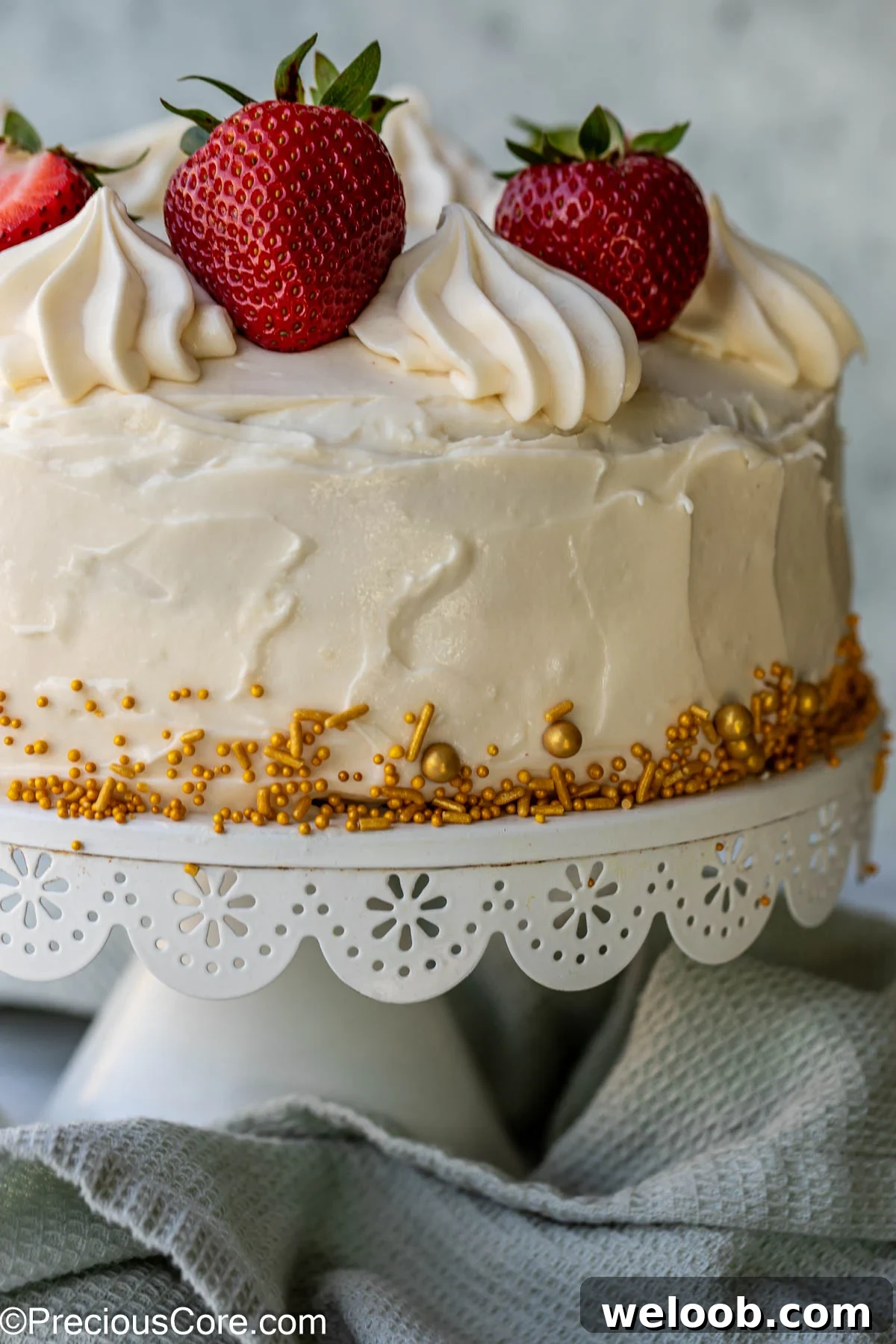 A fully frosted red velvet cake.