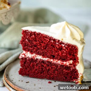 A slice of red velvet cake on a plate.