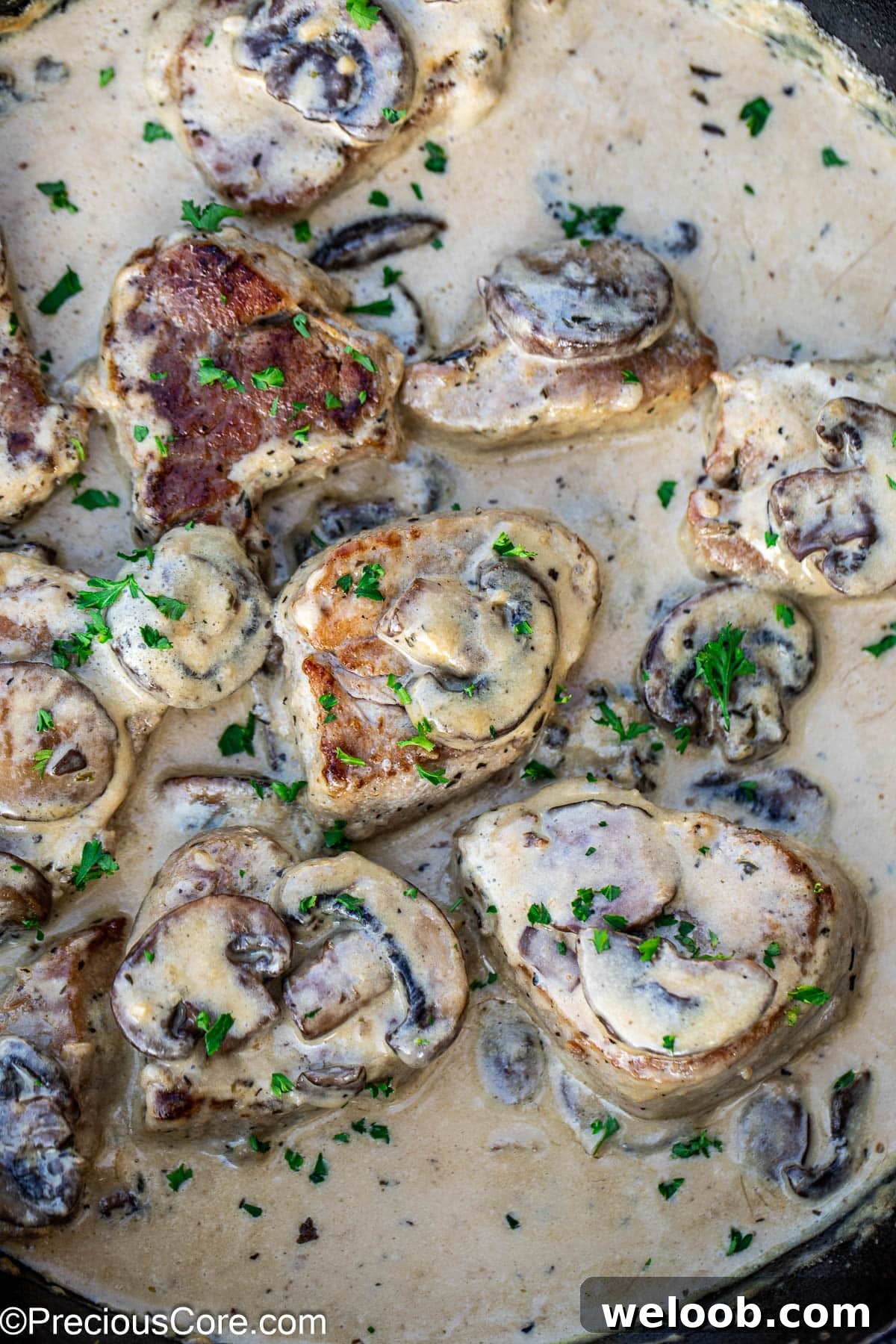Cooked pork tenderloin in a creamy sauce with mushrooms.