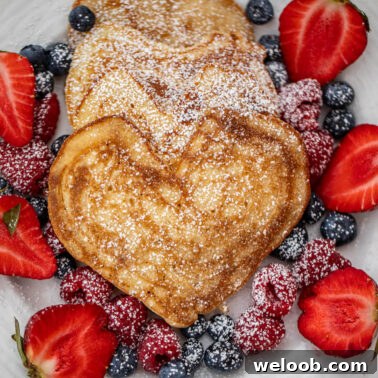 Square image of heart pancakes.