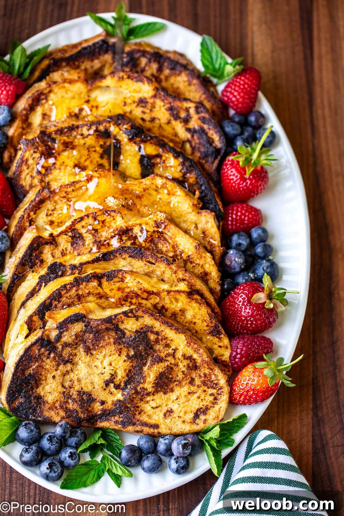 Sourdough French Toast served with fresh berries and syrup.