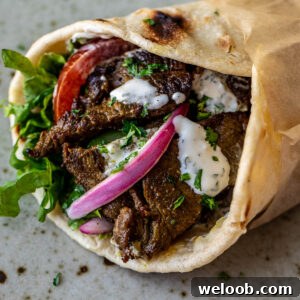 Close up image of beef shawarma wrap.