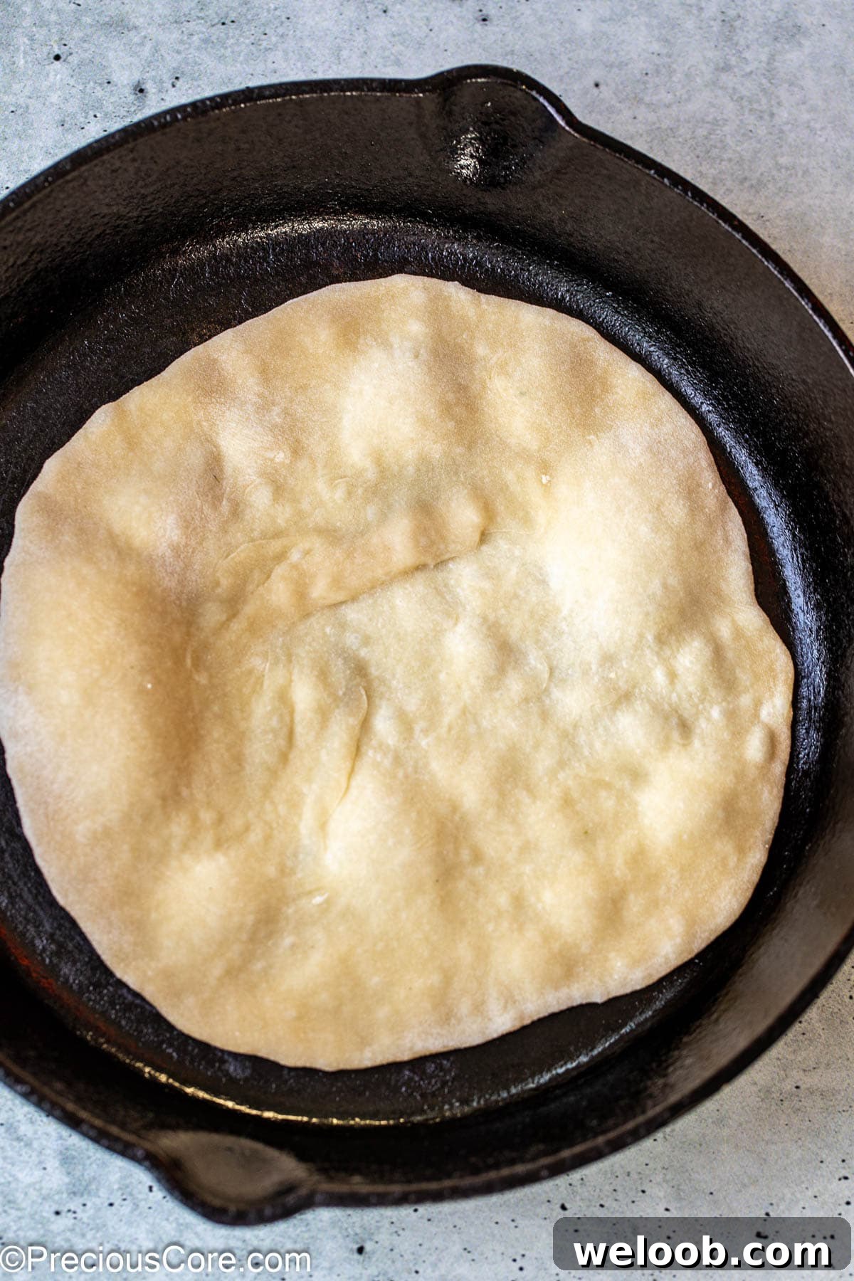 Shawarma bread cooking in a skillet.