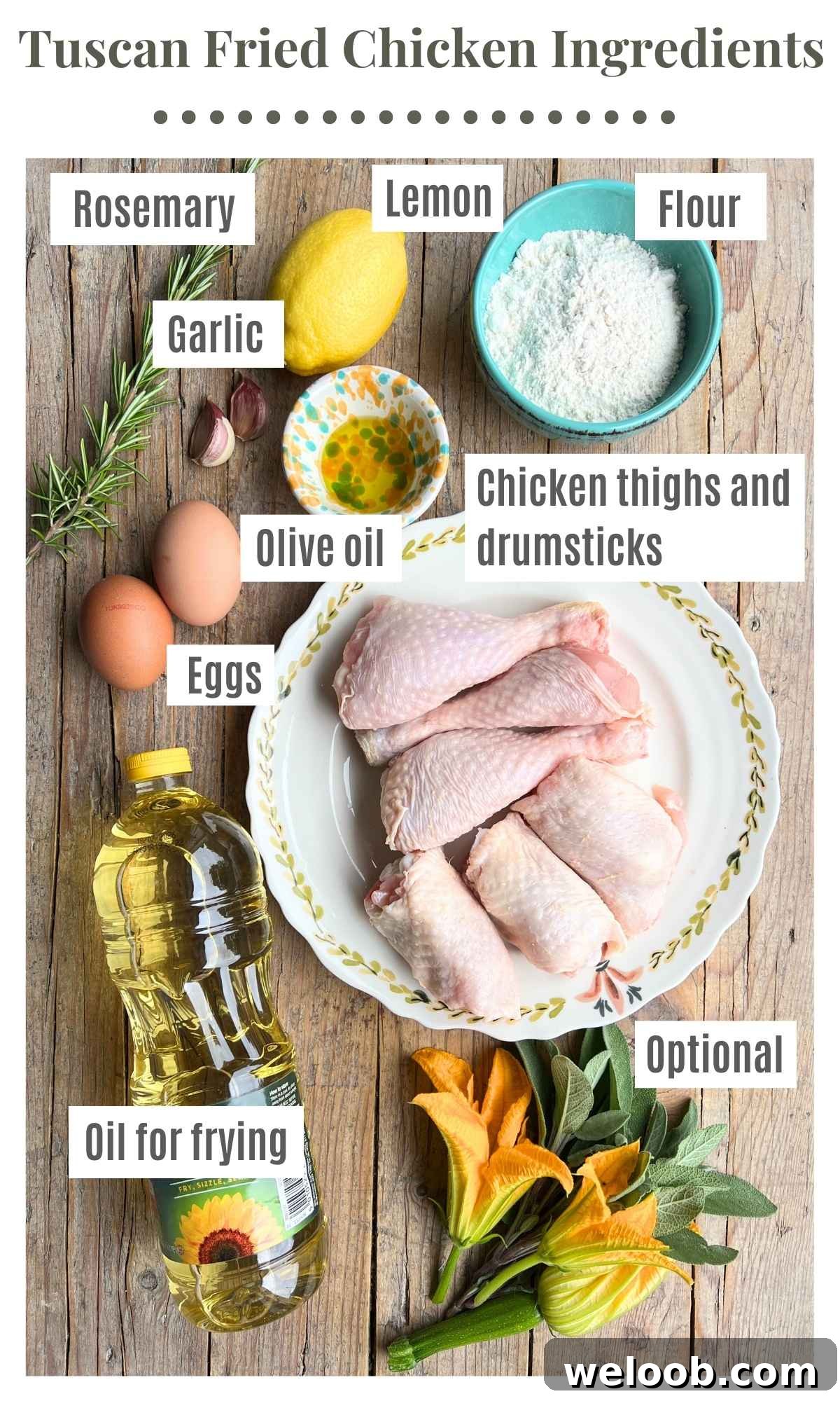 All the ingredients needed to make Tuscan fried chicken laying on a rustic wooden surface.