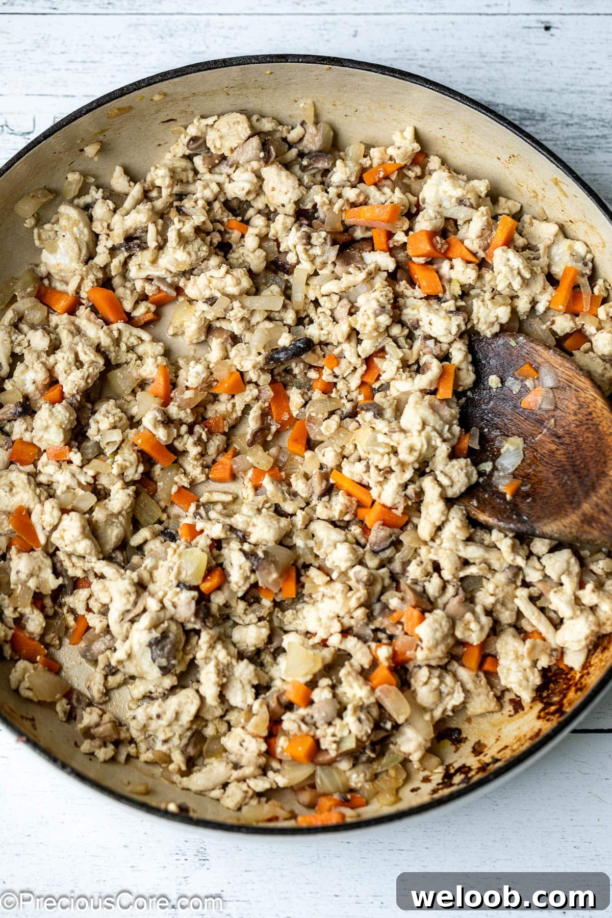 Cooked ground chicken in a pot.