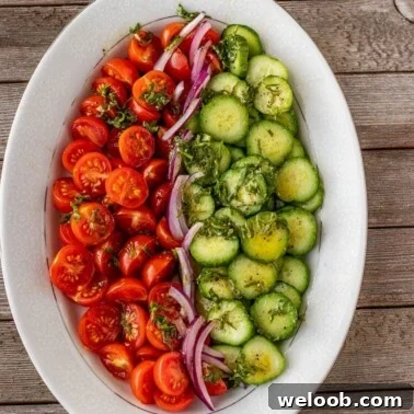 tomato cucumber salad on a platter