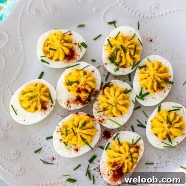 Deviled eggs with paprika and herbs.