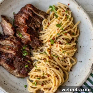 Steak and Pasta with homemade garlic cream sauce.