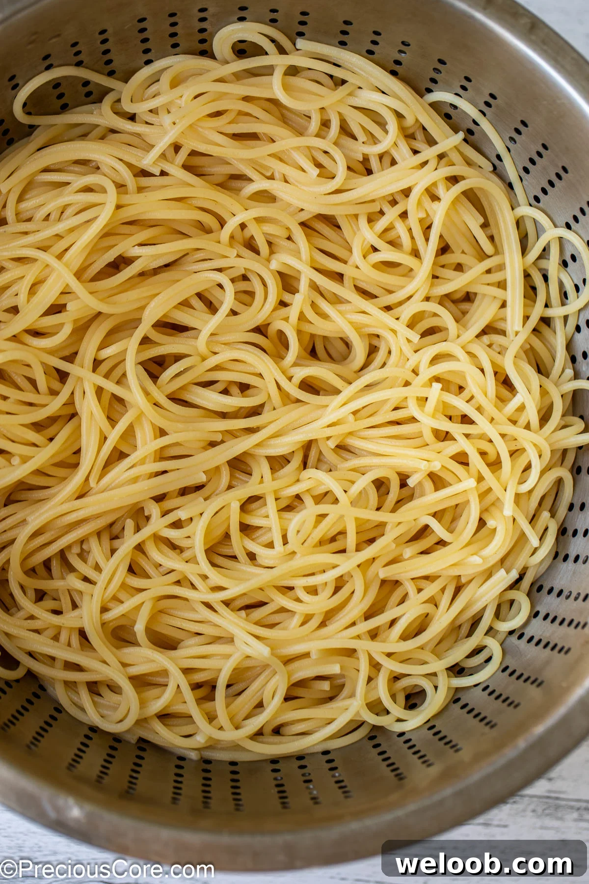 Cooked and drained spaghetti pasta.