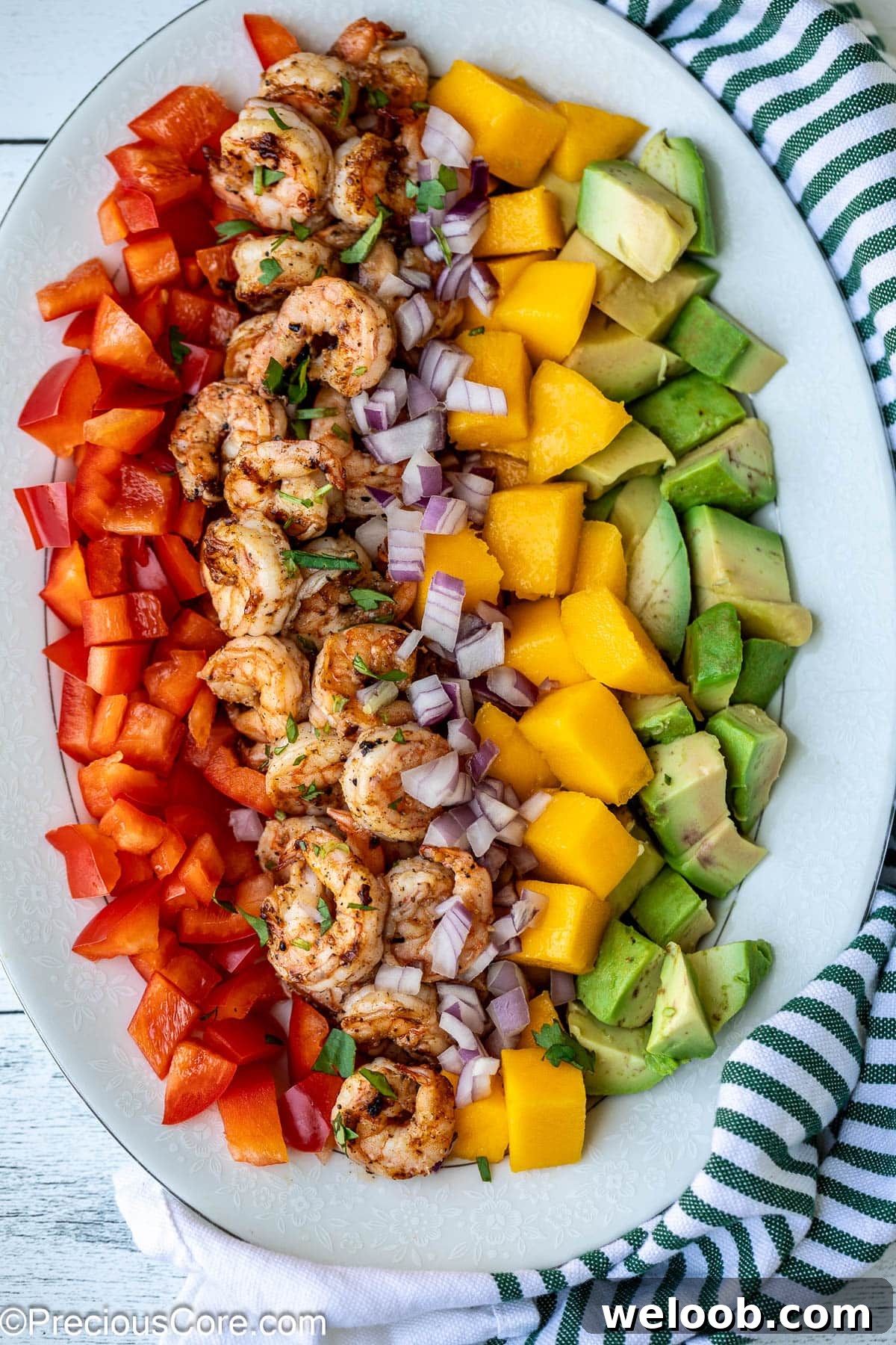 Diced mango, cooked shrimp, avocado, and bell peppers.