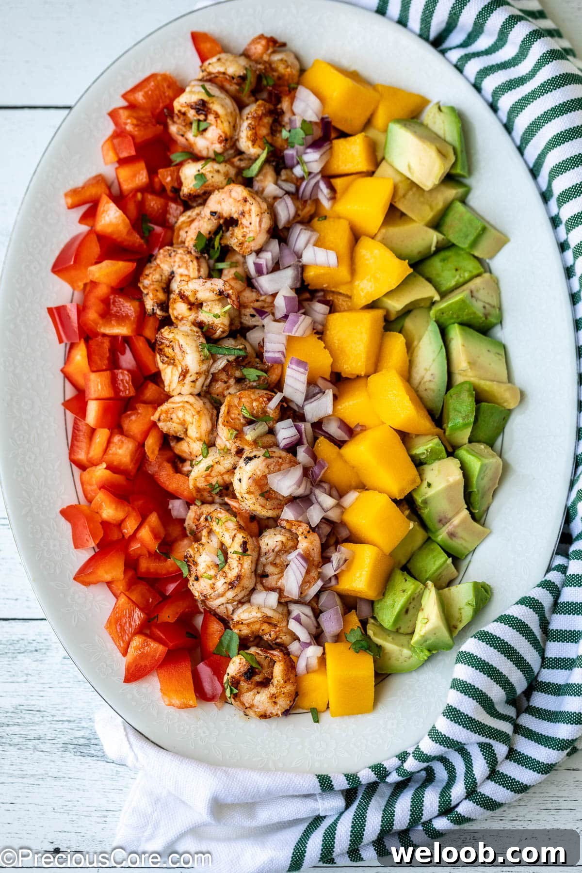 All ingredients for Mango Avocado Salad on a platter.