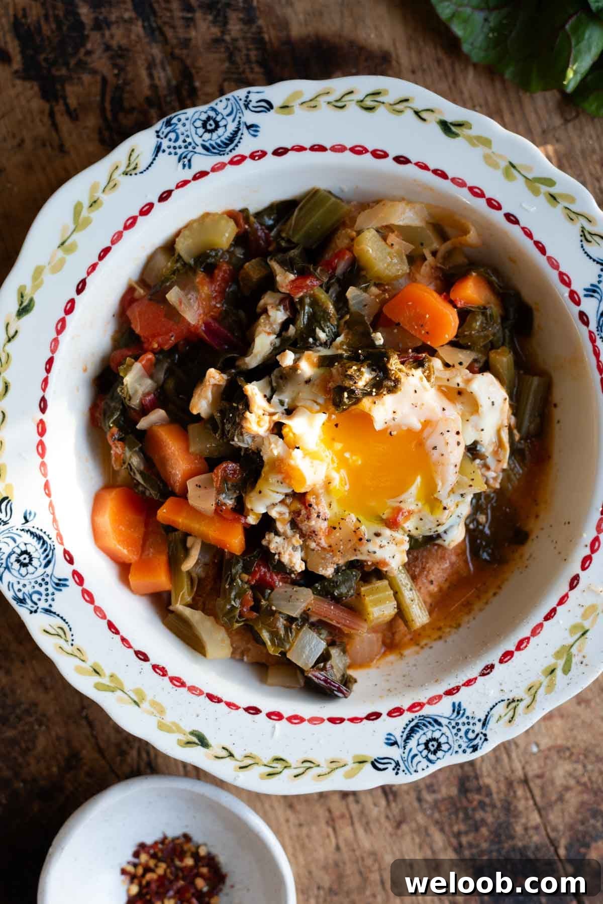 A Tuscan soup called Acquacotta in a vintage style bowl topped with a poached egg.