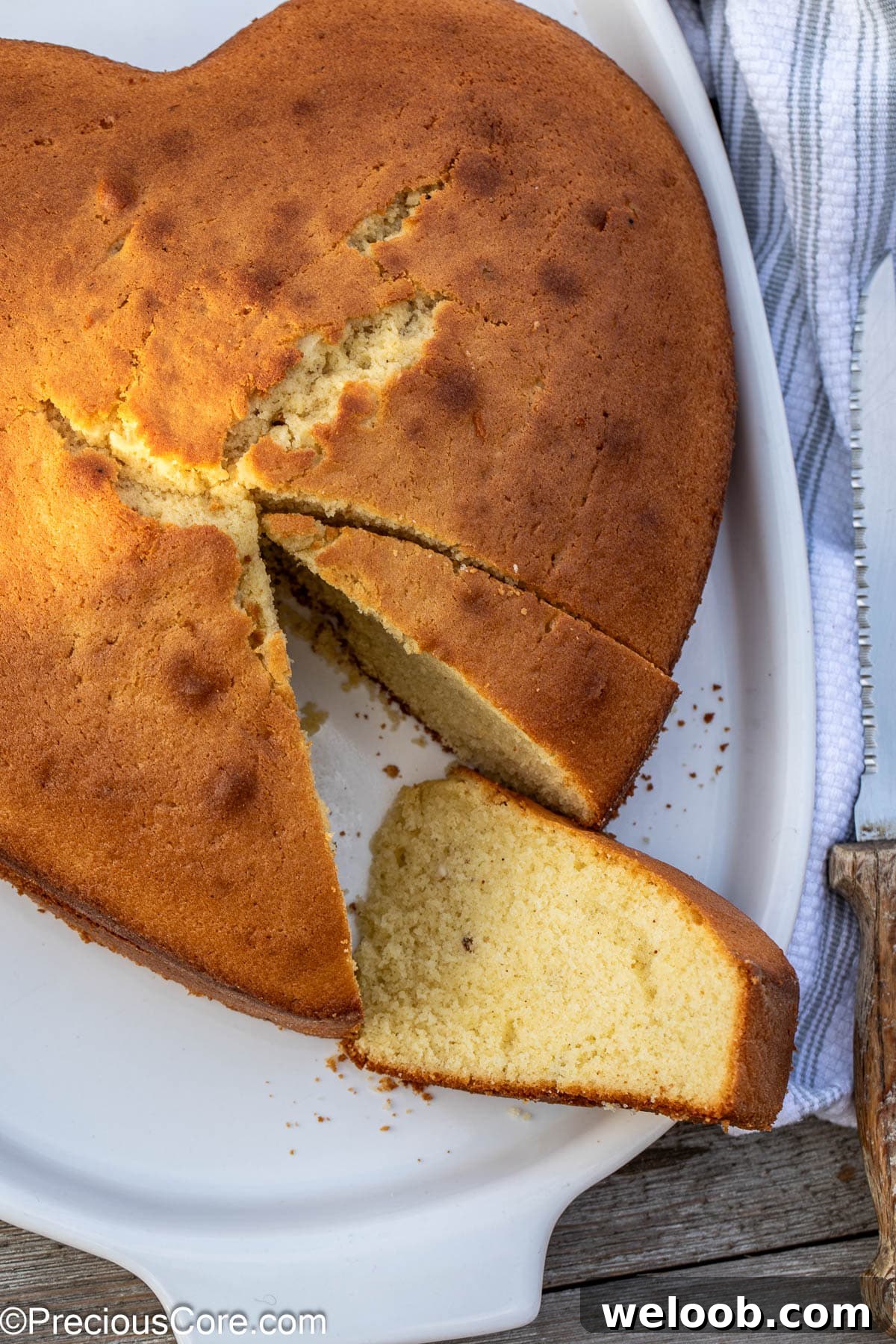 Plain cake with slices taken out.