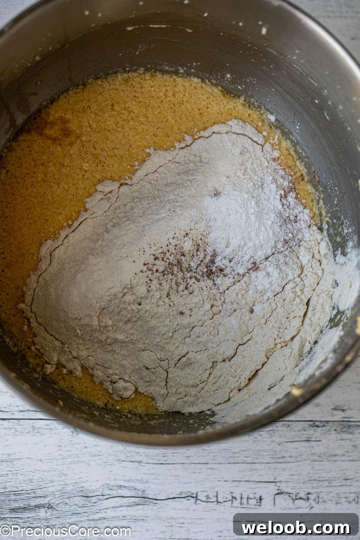 Dry ingredients added to cake batter.