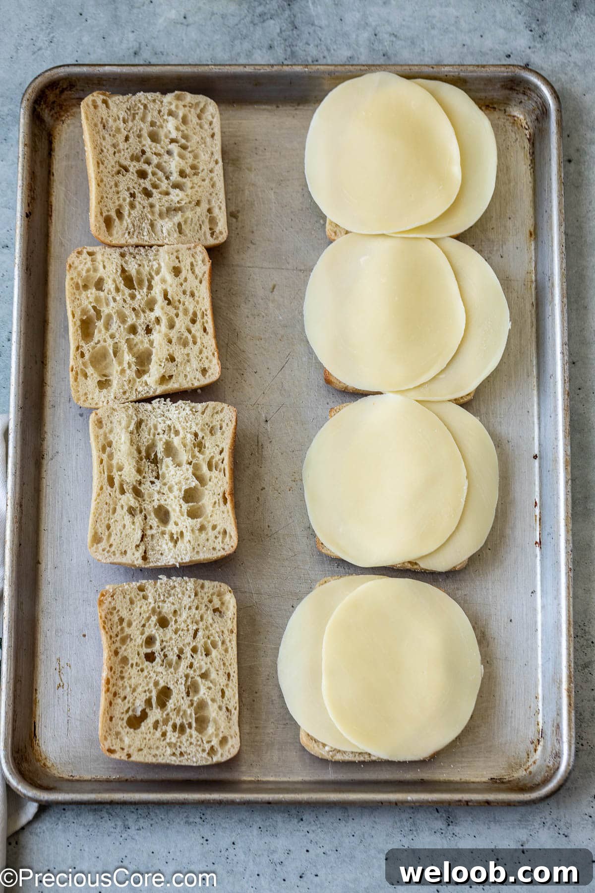 Ciabatta sandwich bread and cheese slices.