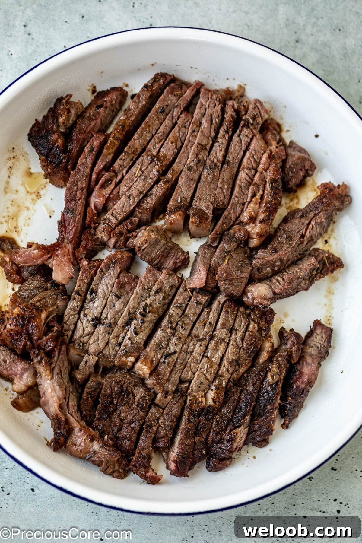 Cooked and sliced ribeye steak.
