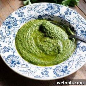 A close up of Tuscan salsa verde in a blue floral plate.