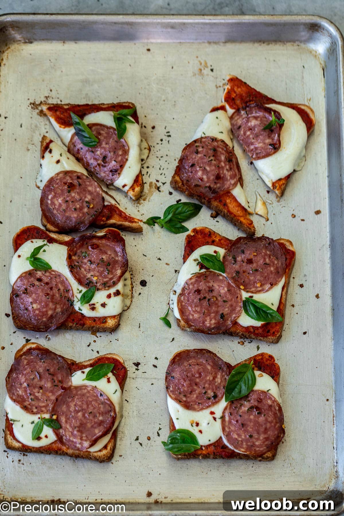 Pizza toasts cut into triangles.