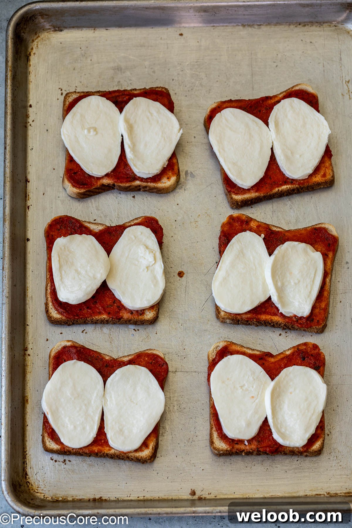 Fresh mozzarella on bread slices.