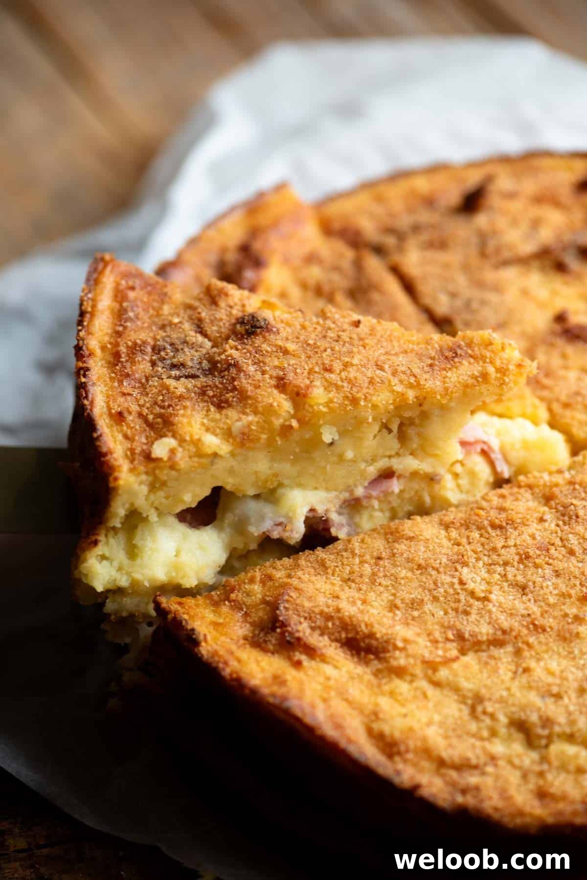 A close up of a slice of Neapolitan potato cake.
