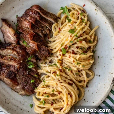 Steak and Pasta with homemade garlic cream sauce.