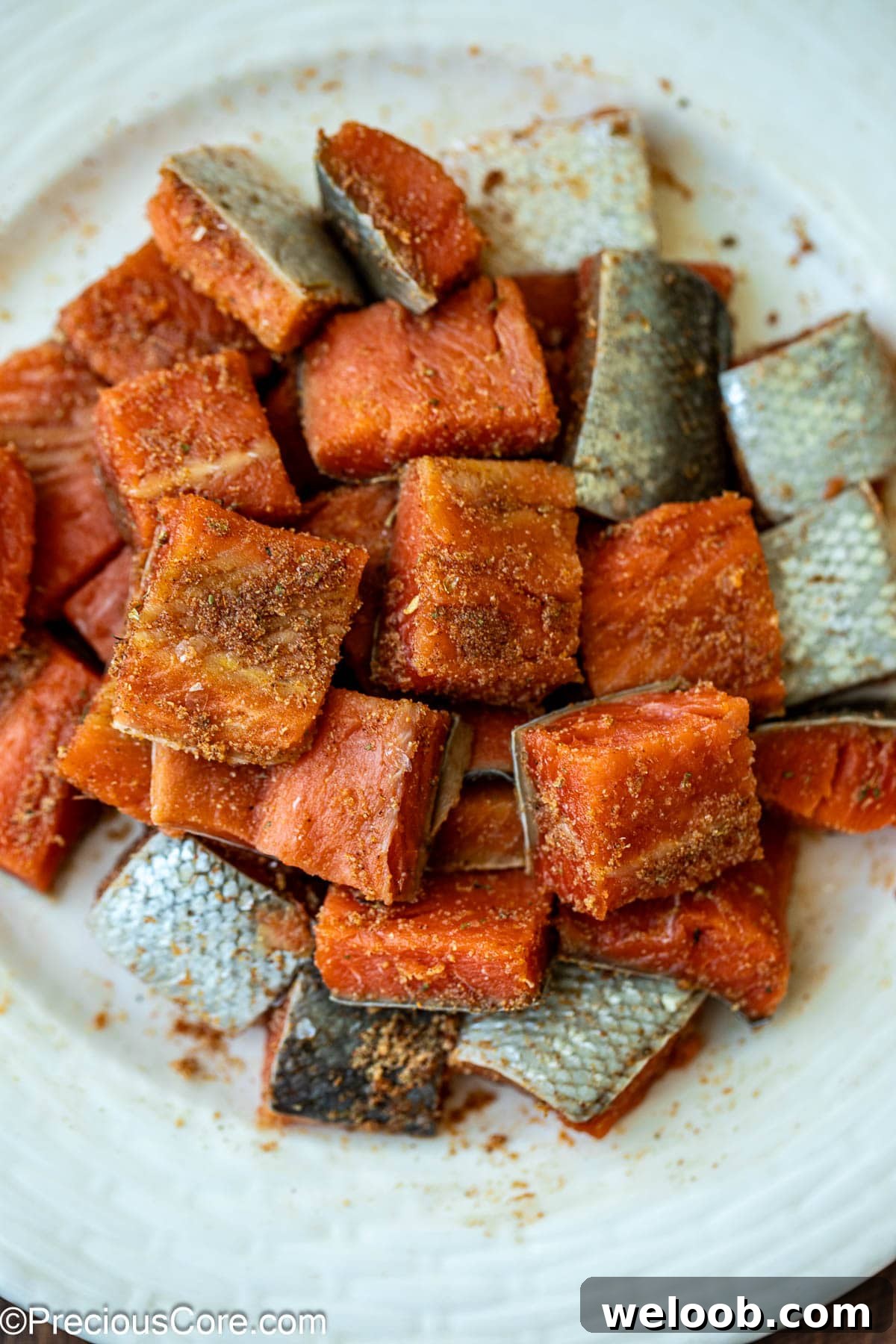 Raw salmon seasoned with spices.