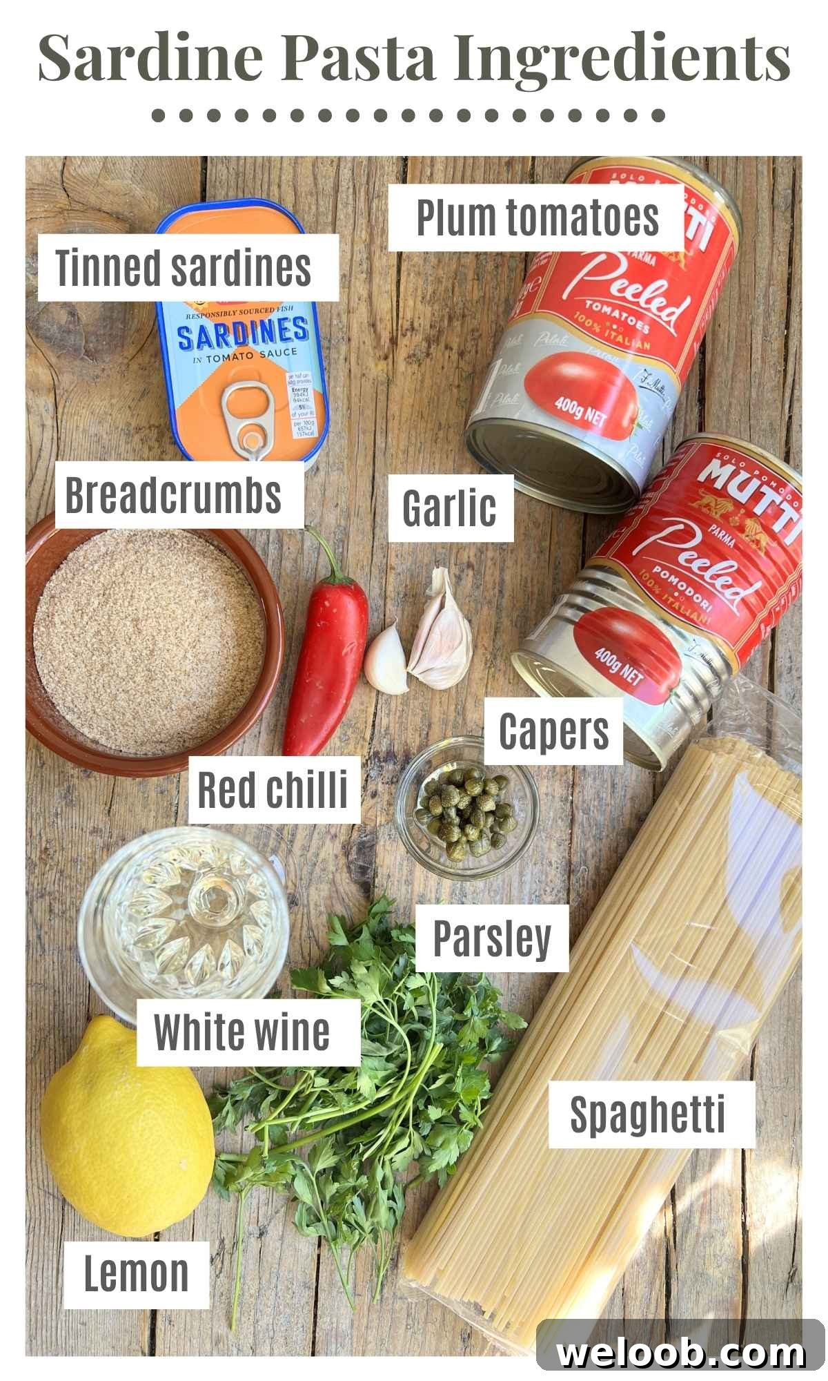 An overhead shot off all the ingredients needed to make sardine pasta with tomatoes, chilli and breadcrumbs.