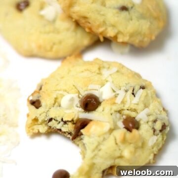 Coconut chocolate chip cookie missing a bite.