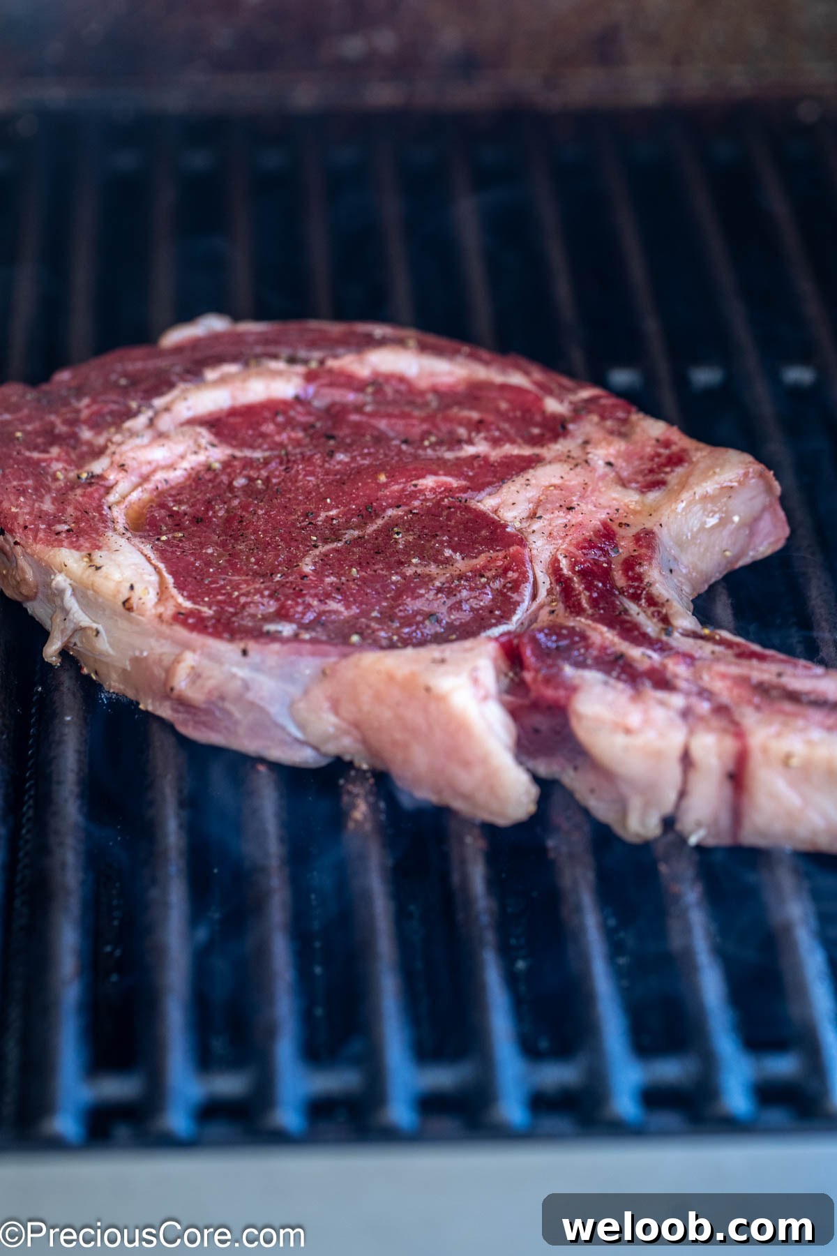 Grilling steak on outside grill.